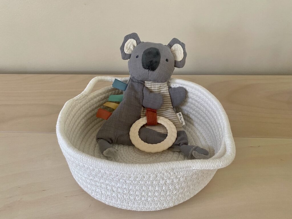 A crinkly Koala stuffie with a teething ring